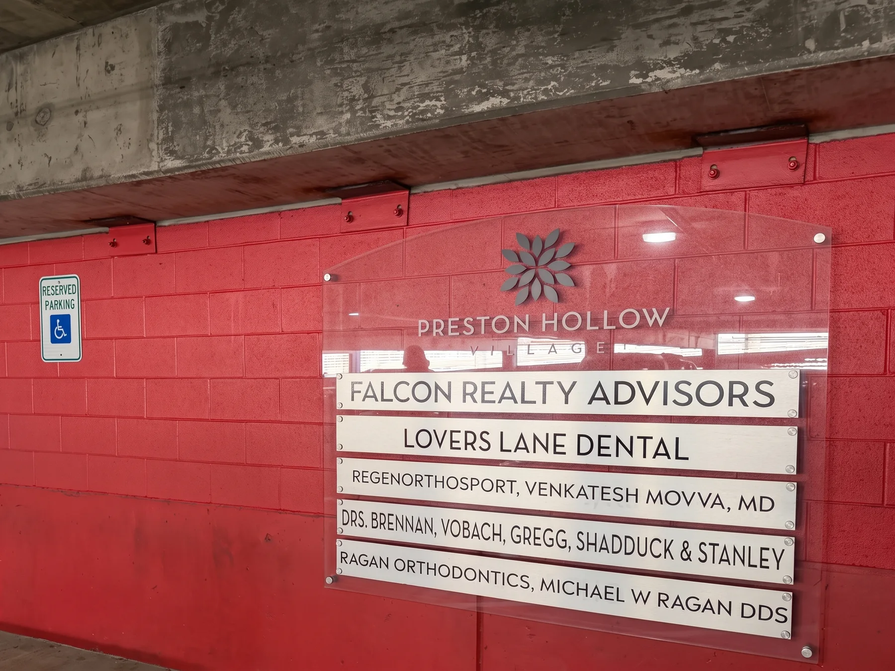 Parking garage sign listing RegenOrthoSport, Venkatesh Movva, MD