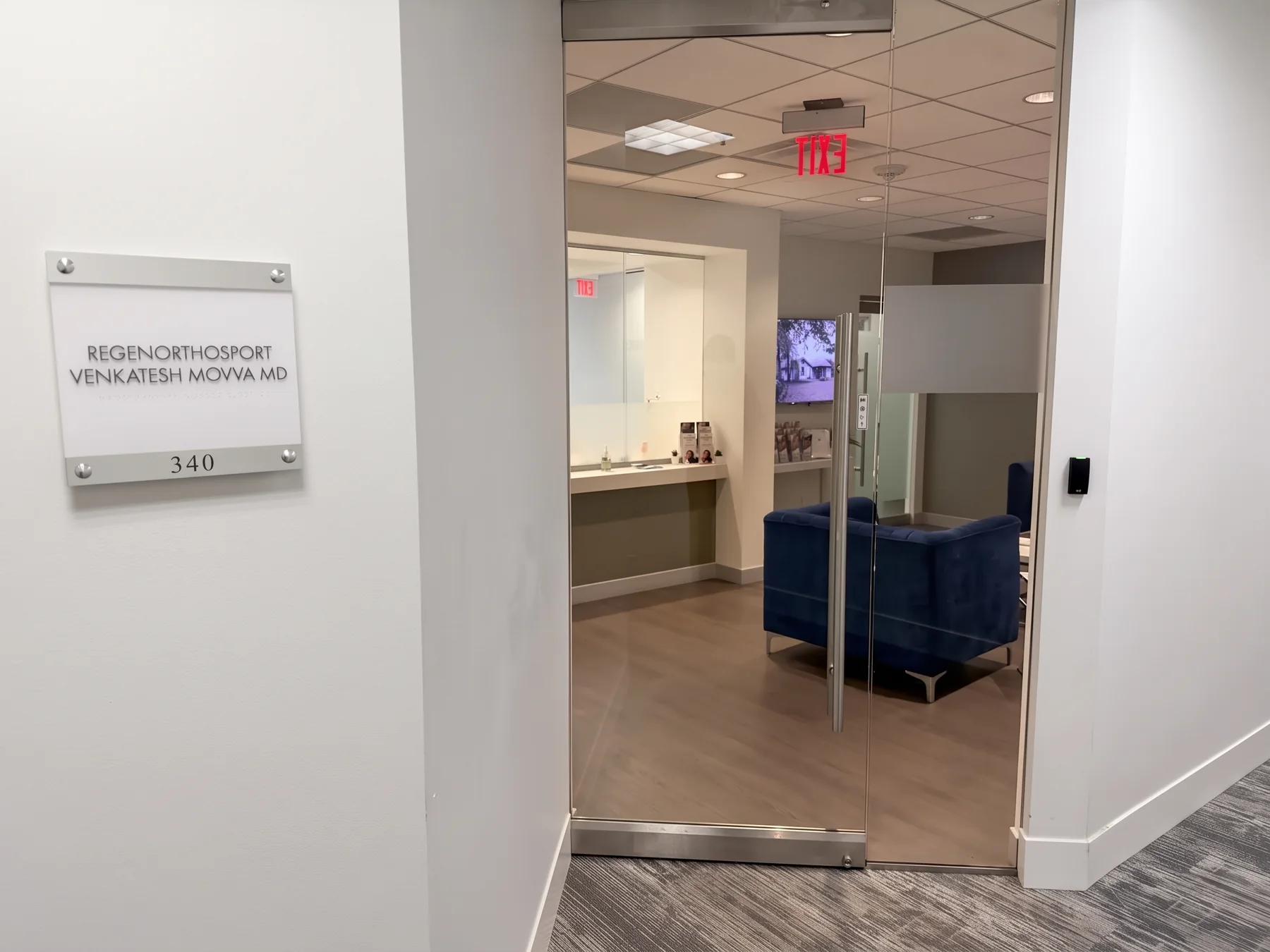 Suite 340 entrance with the RegenOrthoSport nameplate beside the glass door