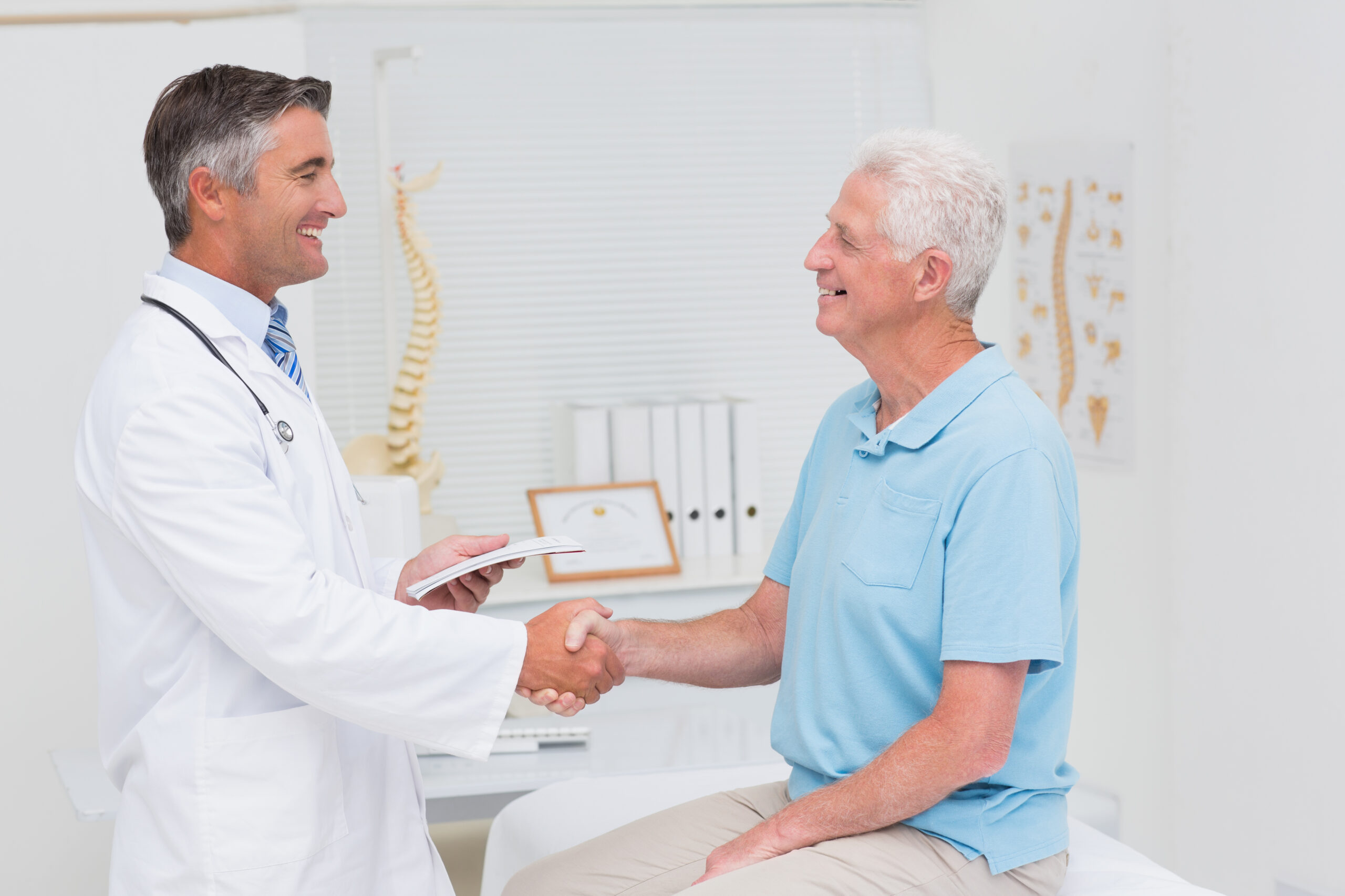 Patient happy with doctor after cervical and spondylitis treatment