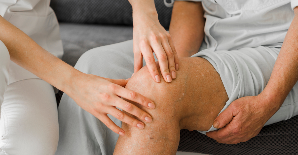 Doctor treating patient who is suffering from knee osteoerthritis